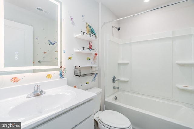 bathroom featuring toilet, vanity, visible vents, and bathing tub / shower combination
