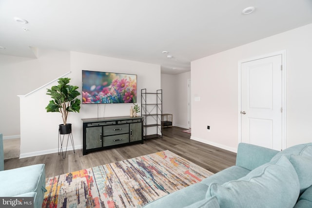 living room featuring baseboards and wood finished floors