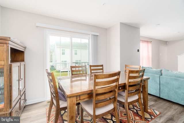 dining area featuring light wood finished floors and a wealth of natural light