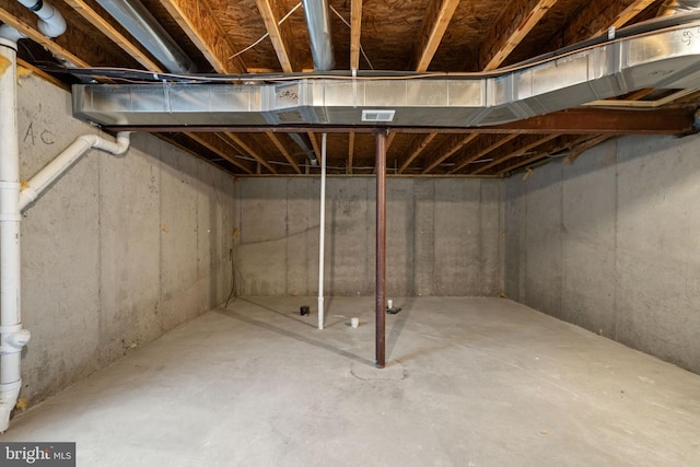 unfinished basement featuring visible vents