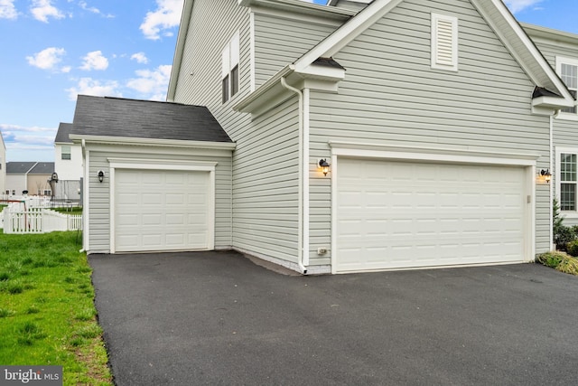 exterior space with a garage and driveway