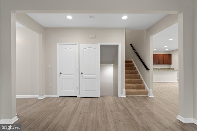 interior space with wood finished floors, baseboards, and recessed lighting