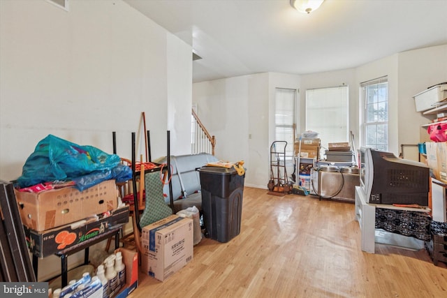interior space with wood finished floors and stairway