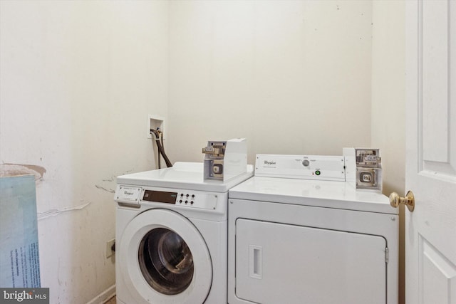 clothes washing area with laundry area and washer and clothes dryer