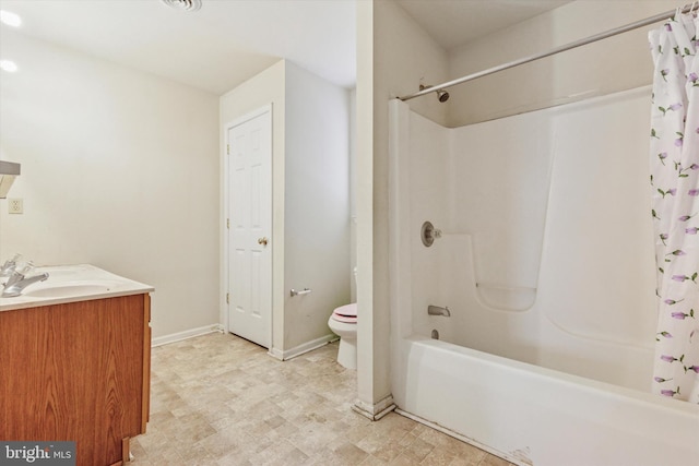 bathroom with toilet, vanity, baseboards, and shower / tub combo with curtain