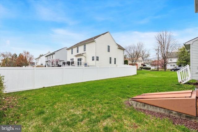view of yard with fence and a residential view