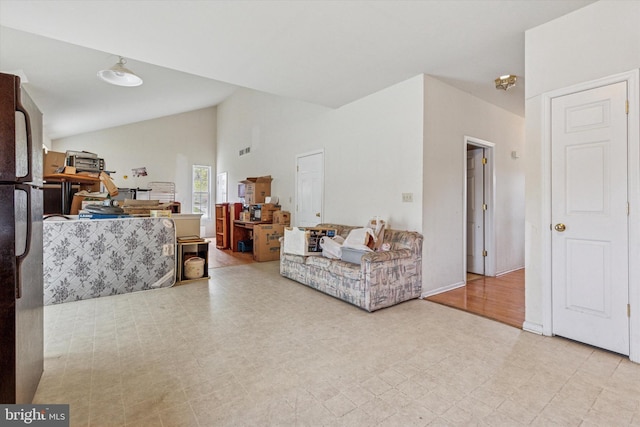 living area featuring vaulted ceiling