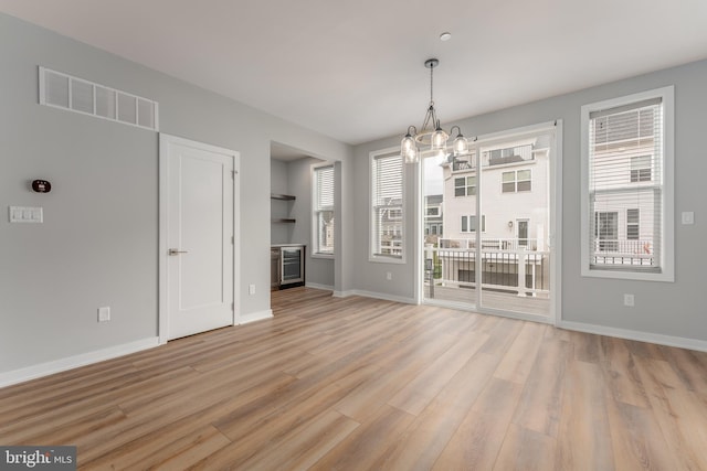 350 Star Tavern Ln, West Chester, PA 19382 - unfurnished dining area featuring an inviting chandelier, a healthy amount of sunlight, visible vents, and light wood-type flooring