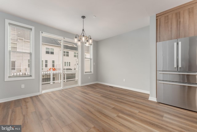 350 Star Tavern Ln, West Chester, PA 19382 - unfurnished dining area with baseboards, an inviting chandelier, and light wood-type flooring
