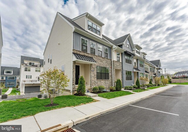 350 Star Tavern Ln, West Chester, PA 19382 - multi unit property with stone siding, uncovered parking, a front lawn, and a residential view