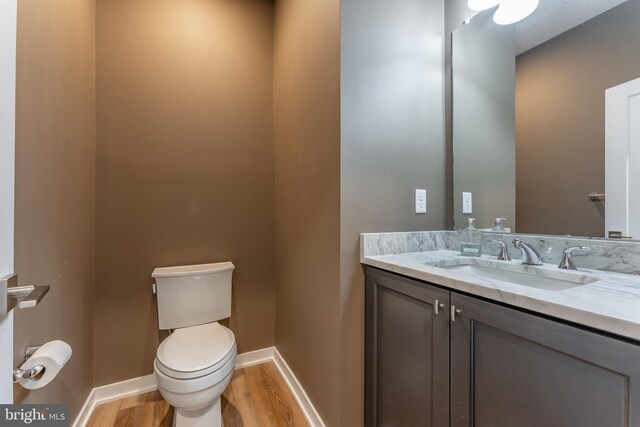 350 Star Tavern Ln, West Chester, PA 19382 - bathroom featuring toilet, vanity, wood finished floors, and baseboards
