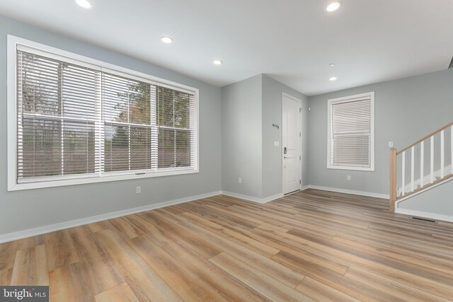 350 Star Tavern Ln, West Chester, PA 19382 - unfurnished living room with recessed lighting, light wood finished floors, and baseboards