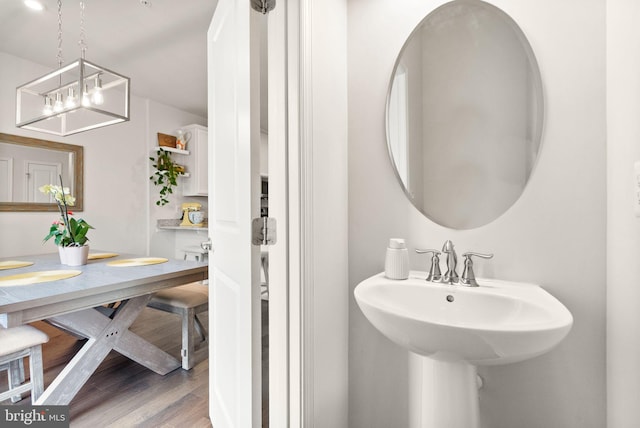 22186 Mccormick Ter, Ashburn, VA 20148 - bathroom featuring a sink and wood finished floors