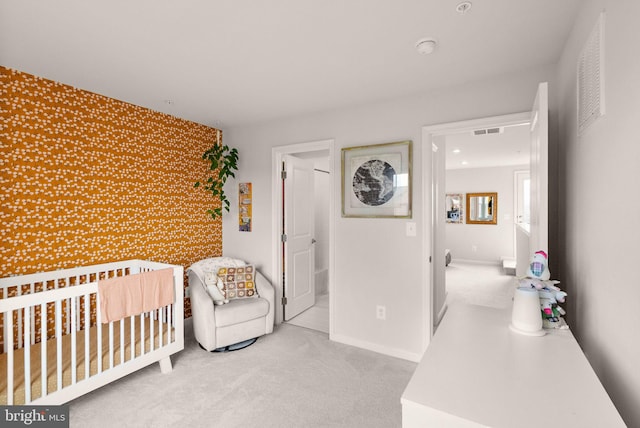 22186 Mccormick Ter, Ashburn, VA 20148 - bedroom featuring an accent wall, carpet flooring, and baseboards