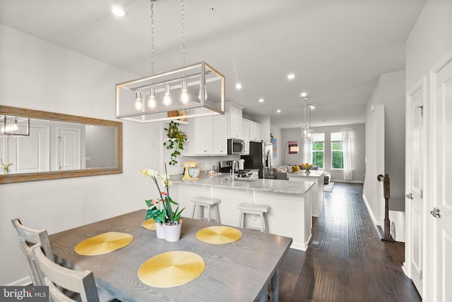22186 Mccormick Ter, Ashburn, VA 20148 - dining space with dark wood-style floors, recessed lighting, and baseboards