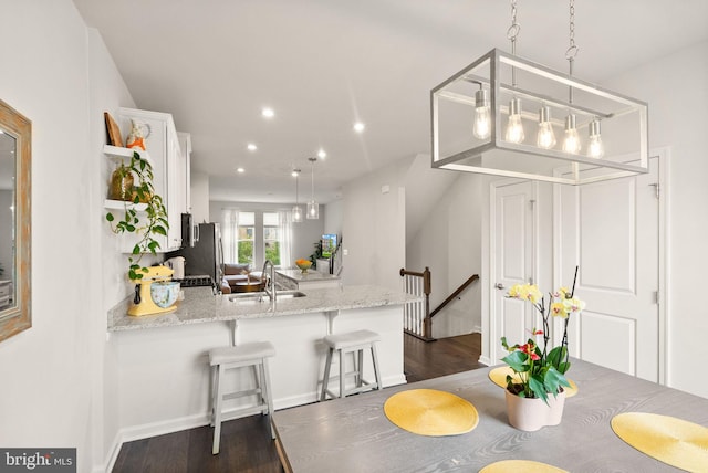 22186 Mccormick Ter, Ashburn, VA 20148 - dining room with dark wood-type flooring and recessed lighting