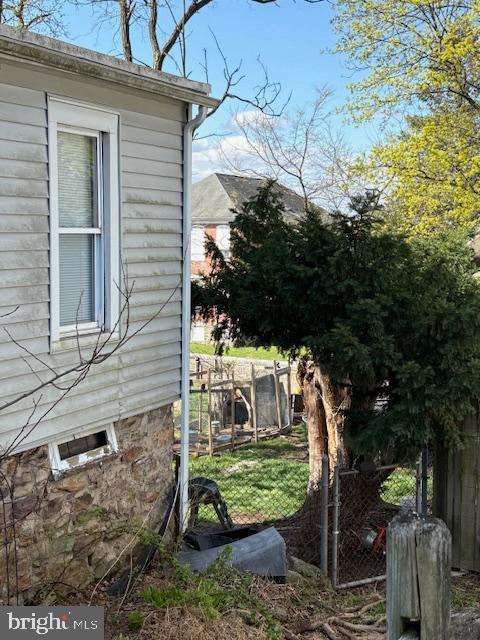 view of side of home with fence