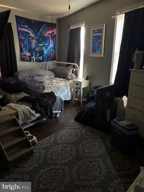 bedroom with wood finished floors