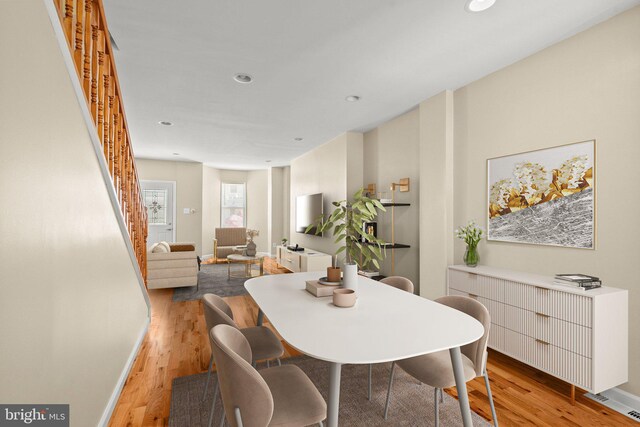 2512 N Marshall St, Philadelphia, PA 19133 - dining area with recessed lighting, stairway, radiator, and wood finished floors
