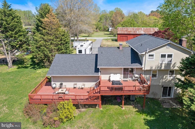 5650 Warren Dr, Huntingtown, MD 20639 - rear view of property with a yard, a deck, and roof with shingles