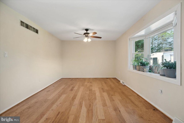 5650 Warren Dr, Huntingtown, MD 20639 - unfurnished room featuring visible vents, a ceiling fan, light wood-style floors, and baseboards