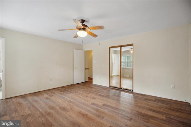 5650 Warren Dr, Huntingtown, MD 20639 - unfurnished bedroom featuring a ceiling fan and wood finished floors