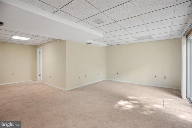 5650 Warren Dr, Huntingtown, MD 20639 - basement with baseboards, light colored carpet, and a paneled ceiling