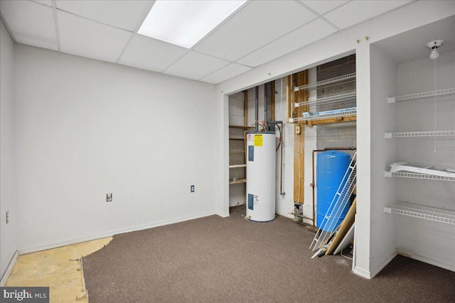 5650 Warren Dr, Huntingtown, MD 20639 - below grade area with water heater, baseboards, a drop ceiling, and carpet flooring