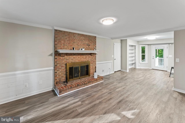 2320 Harpoon Dr, Stafford, VA 22554 - unfurnished living room featuring wood finished floors, a fireplace, crown molding, and built in shelves