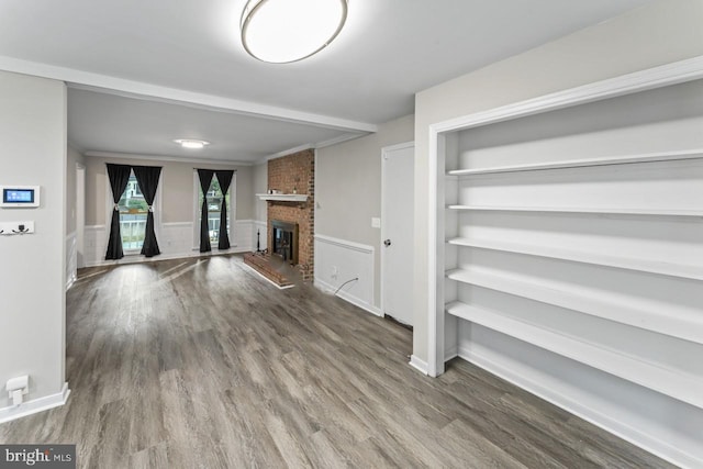 2320 Harpoon Dr, Stafford, VA 22554 - unfurnished living room featuring wood finished floors, a fireplace, and wainscoting