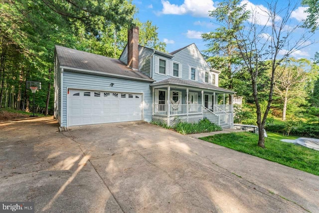 2320 Harpoon Dr, Stafford, VA 22554 - view of front of home featuring a porch, a chimney, driveway, and an attached garage