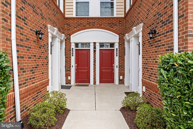 entrance to property with brick siding