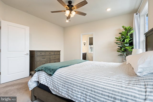 carpeted bedroom featuring ensuite bathroom, ceiling fan, and recessed lighting