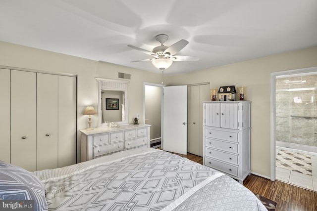 bedroom featuring visible vents, dark wood-style flooring, connected bathroom, and ceiling fan