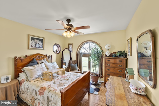 bedroom featuring ceiling fan and wood finished floors