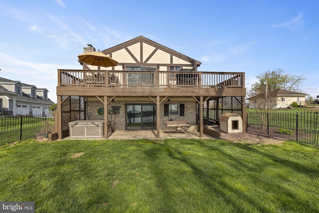 rear view of house with a patio area, a lawn, a chimney, a fenced backyard, and brick siding