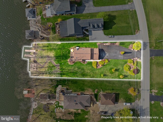 aerial view with a residential view and a water view