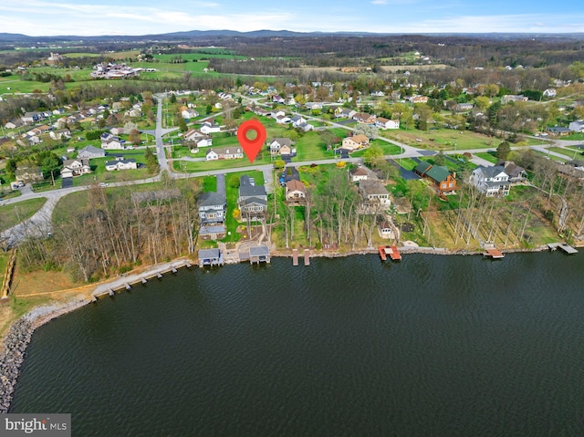bird's eye view featuring a water view and a residential view