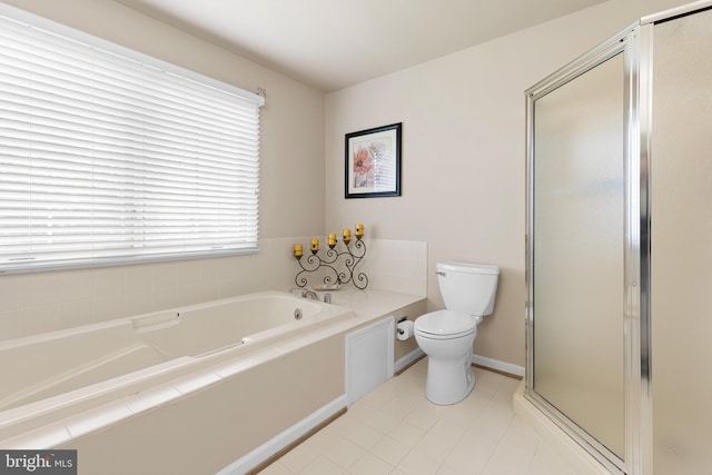 bathroom featuring a shower stall, baseboards, toilet, a bath, and tile patterned flooring