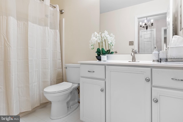 full bathroom with a chandelier, tile patterned floors, toilet, and vanity
