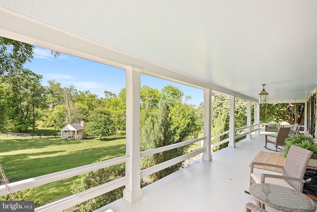 36437 Whispering Springs Ct, Purcellville, VA 20132 - covered porch featuring a lawn and view of wooded area