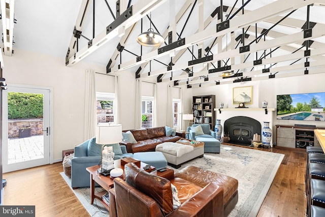 36437 Whispering Springs Ct, Purcellville, VA 20132 - living area featuring plenty of natural light, wood finished floors, high vaulted ceiling, and beamed ceiling