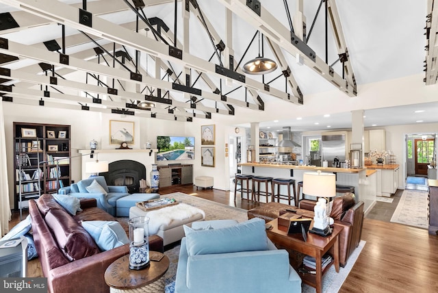 36437 Whispering Springs Ct, Purcellville, VA 20132 - living area featuring high vaulted ceiling, wood finished floors, and beamed ceiling