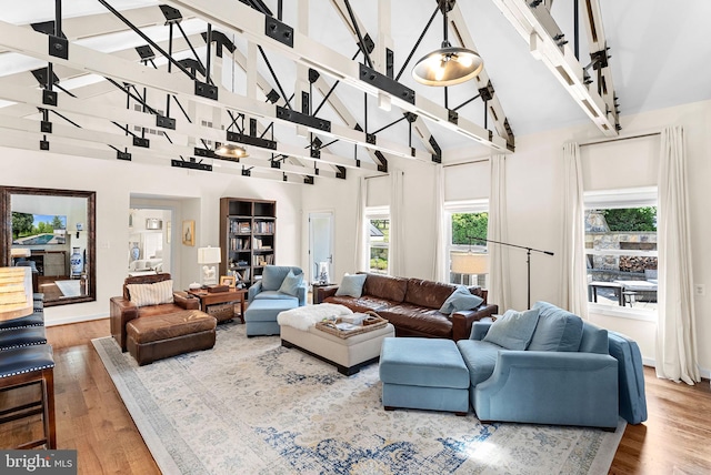 36437 Whispering Springs Ct, Purcellville, VA 20132 - living area with wood finished floors, beam ceiling, and high vaulted ceiling