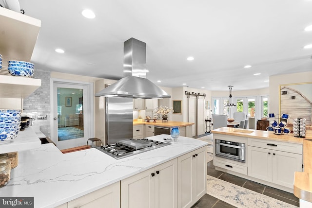 36437 Whispering Springs Ct, Purcellville, VA 20132 - kitchen featuring island exhaust hood, appliances with stainless steel finishes, wooden counters, recessed lighting, and tasteful backsplash