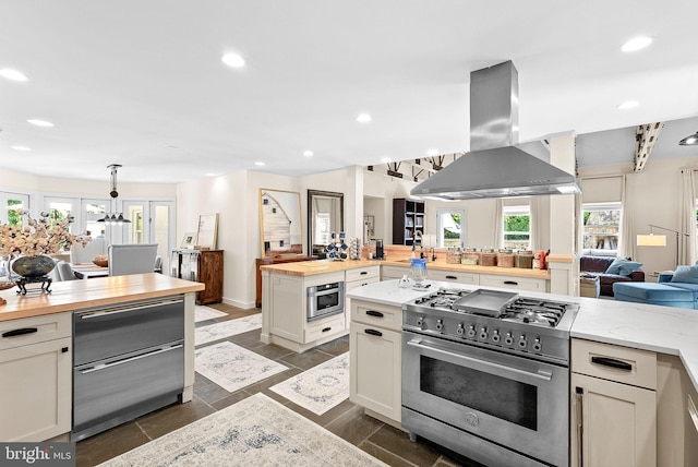 36437 Whispering Springs Ct, Purcellville, VA 20132 - kitchen featuring high end stainless steel range oven, wood counters, island range hood, open floor plan, and recessed lighting