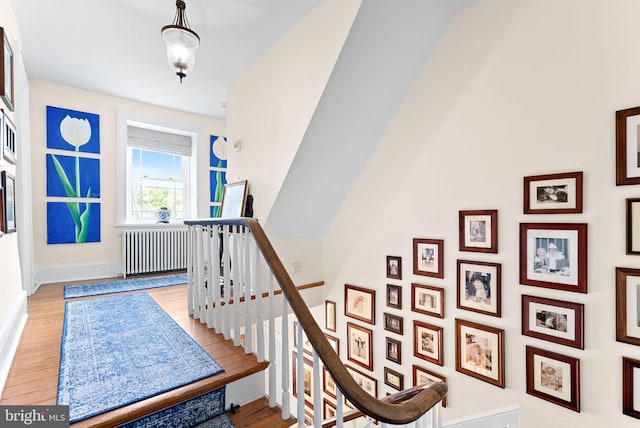 36437 Whispering Springs Ct, Purcellville, VA 20132 - stairs with radiator heating unit, wood finished floors, and baseboards