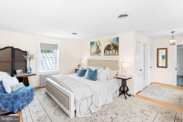36437 Whispering Springs Ct, Purcellville, VA 20132 - bedroom featuring radiator, wood finished floors, and baseboards