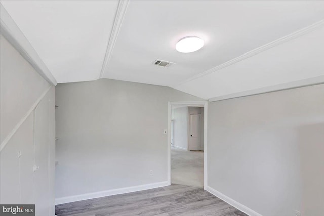3404 Chesley Ave, Baltimore, MD 21234 - empty room with vaulted ceiling, wood finished floors, and baseboards