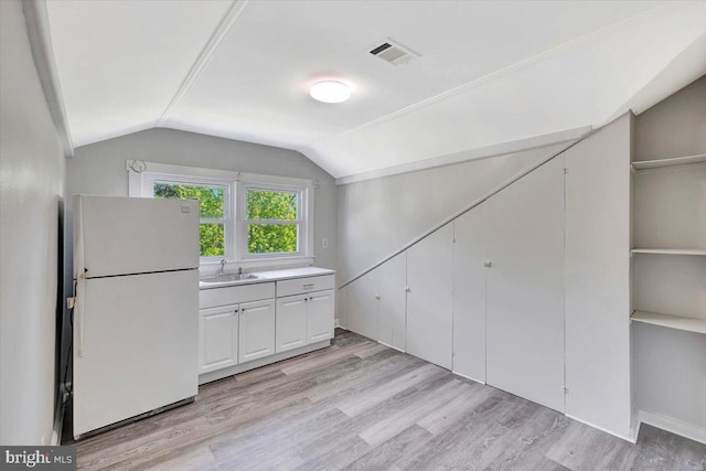 3404 Chesley Ave, Baltimore, MD 21234 - additional living space featuring a sink, vaulted ceiling, and light wood-type flooring